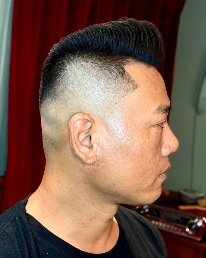 High Skin Fade with Thick Brushed Up Hair
