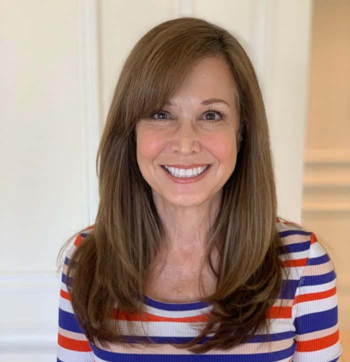 Hairstyles for Women Over 60 - Long Layers & Side Swept Bangs