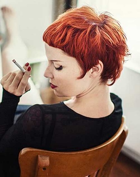 bright red pixie haircut for women with bangs