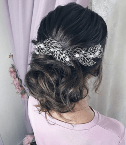Stunning Wedding Hairstyles for the 2019 Season | Untied Curly Bun | Hairstyleonpoint.com