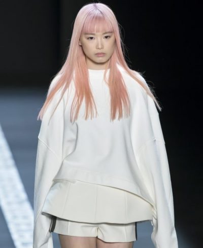 Model with long hair and straight-across bangs