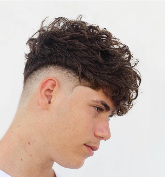 Image of Messy V-cut hairstyle with a fringe for men