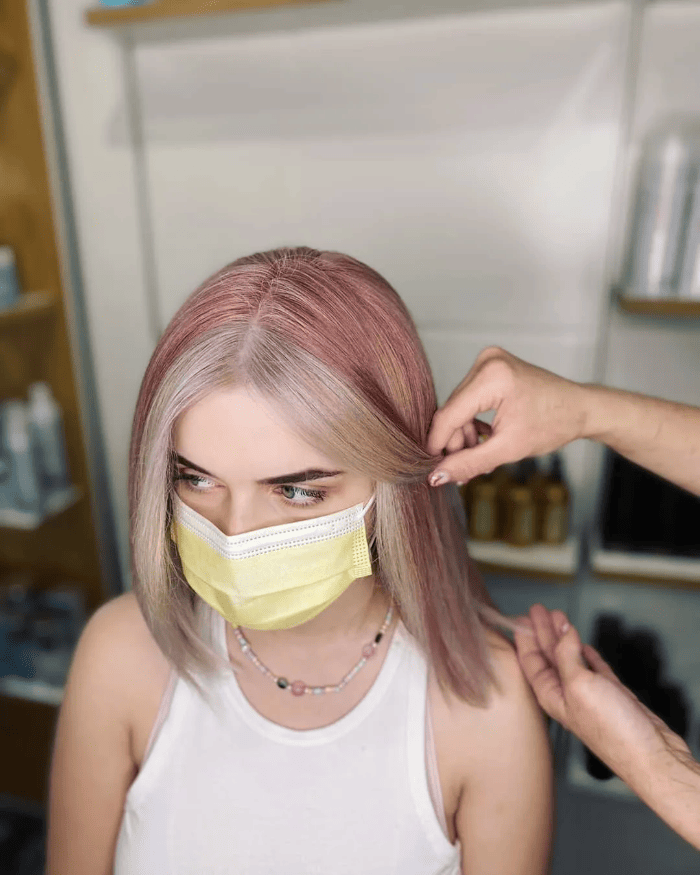 Pink highlights in blonde hair